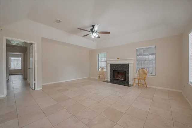 wooden floor fireplace and windows in a room