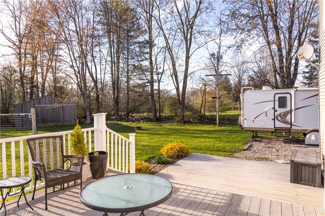 4750 Turney Road Madison, OH 44057 - Photo 36 of 42 Wooden deck featuring a lawn