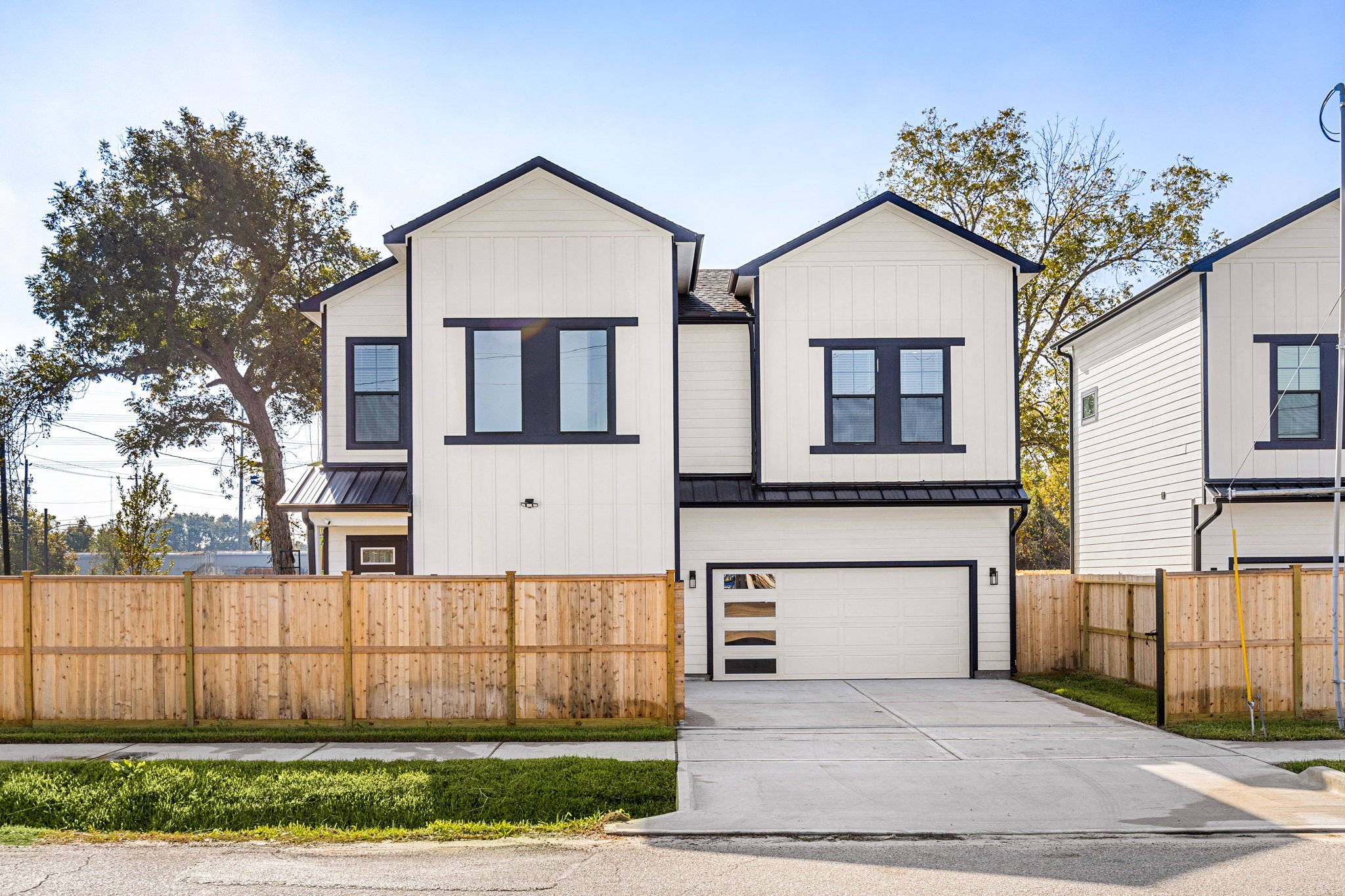 2720 Spence Street Houston, TX 77093 - Photo 2 of 50 a front view of a house with a yard and garage