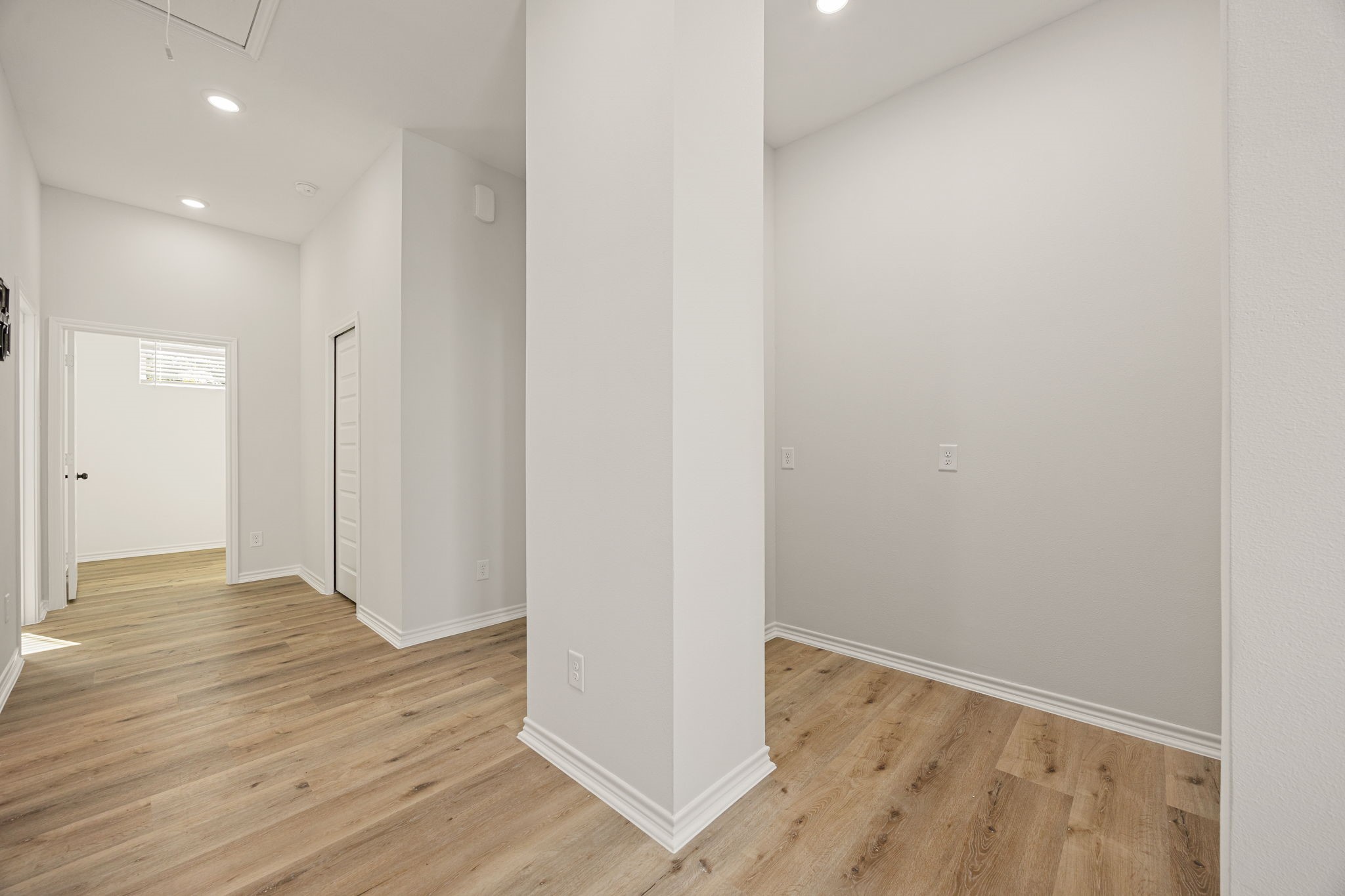 2720 Spence Street Houston, TX 77093 - Photo 22 of 50 a view of an empty room with wooden floor and a window