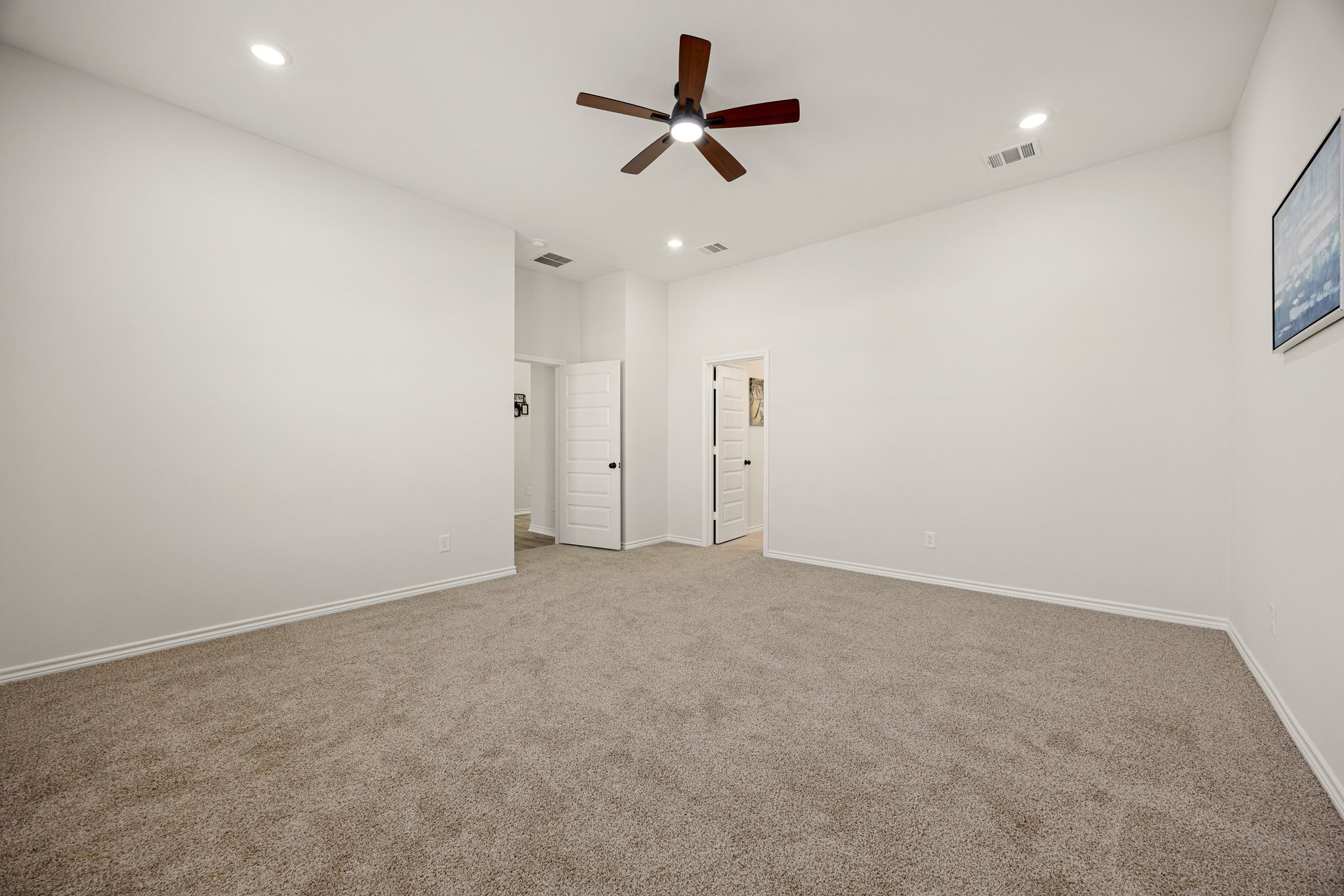 2720 Spence Street Houston, TX 77093 - Photo 24 of 50 an empty room with ceiling fan and window