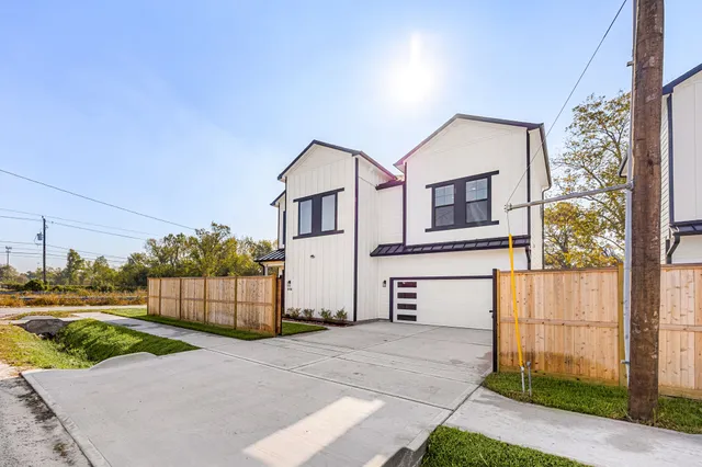 a front view of a house with a garage