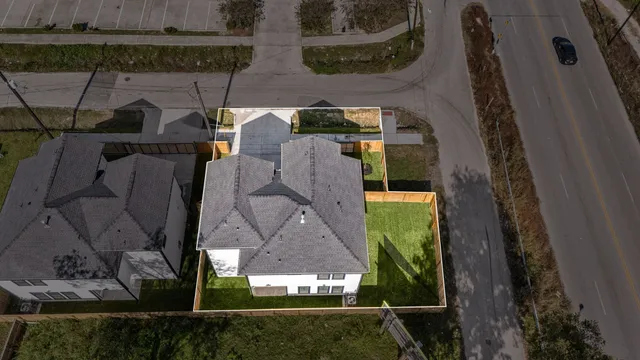 an aerial view of a house having yard