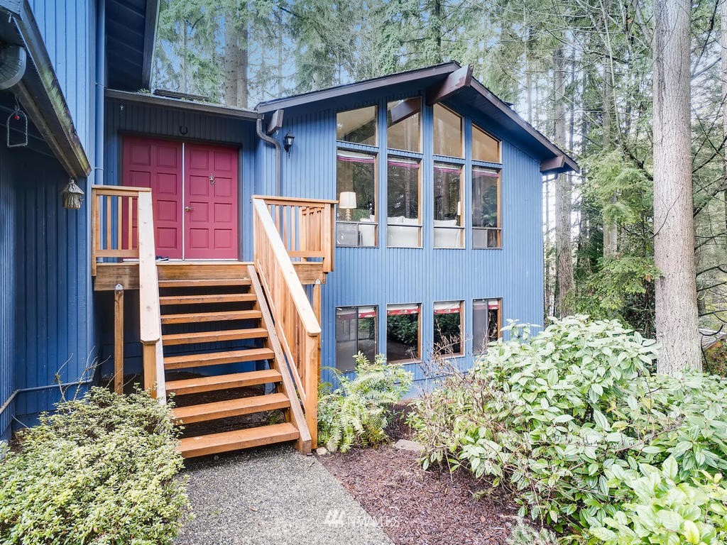 20931 29th Avenue Southeast Bothell, WA 98021 - Photo 1 of 32 a front view of a house with a yard