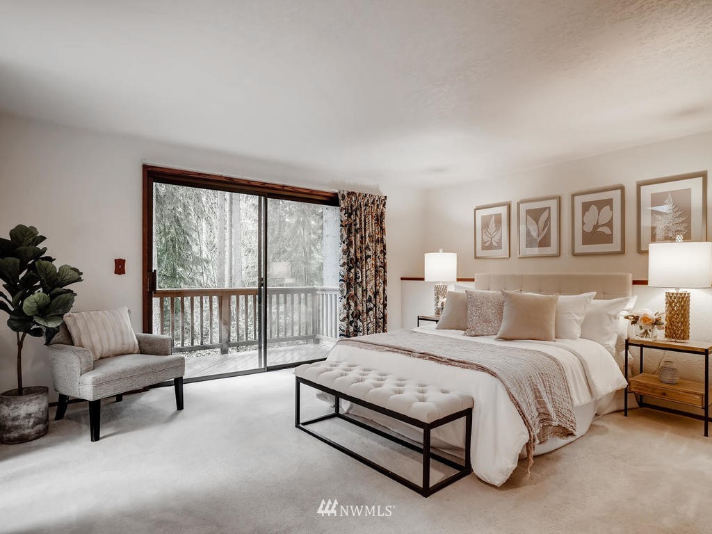 20931 29th Avenue Southeast Bothell, WA 98021 - Photo 17 of 32 a bedroom with a bed and a large window