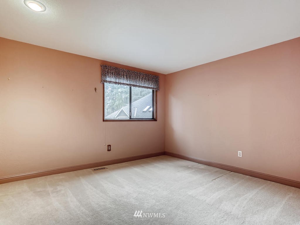 20931 29th Avenue Southeast Bothell, WA 98021 - Photo 20 of 32 an empty room with windows