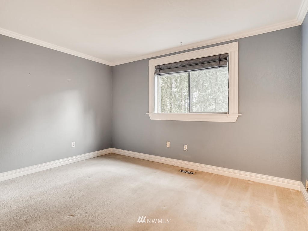 20931 29th Avenue Southeast Bothell, WA 98021 - Photo 21 of 32 a view of an empty room with a window