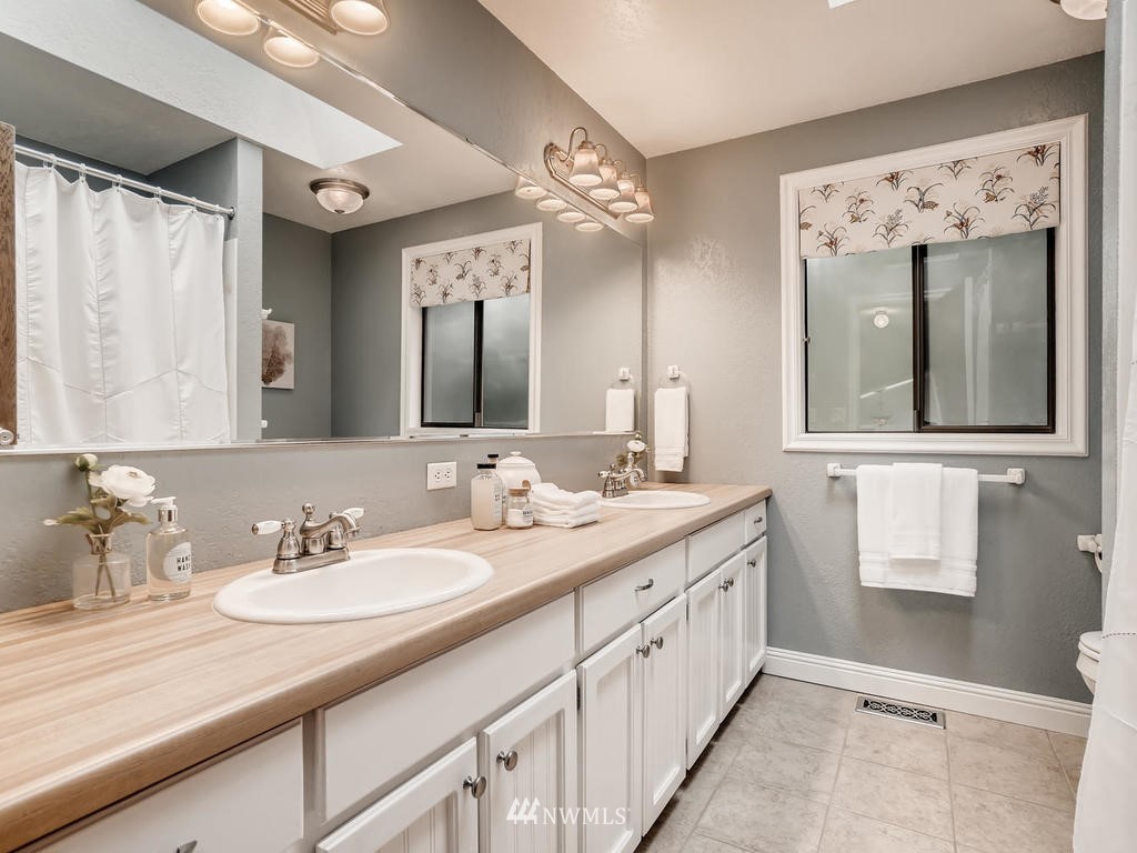 20931 29th Avenue Southeast Bothell, WA 98021 - Photo 22 of 32 a spacious bathroom with a double vanity sink mirror and