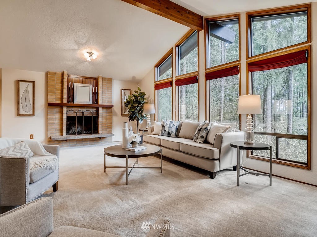 20931 29th Avenue Southeast Bothell, WA 98021 - Photo 5 of 32 a living room with furniture and a fireplace