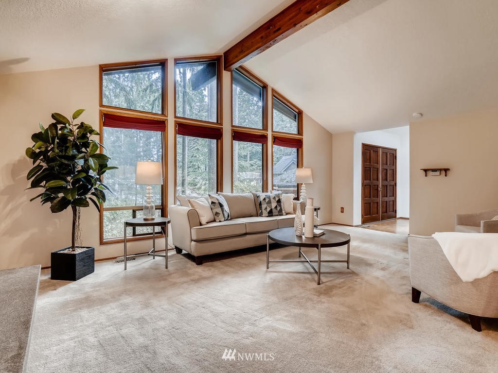 20931 29th Avenue Southeast Bothell, WA 98021 - Photo 7 of 32 a living room with furniture and a large window