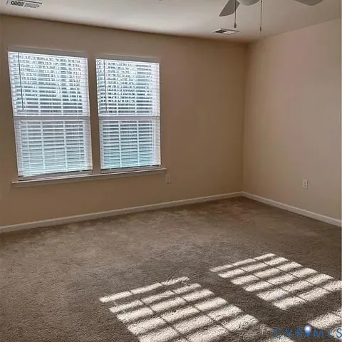 a view of empty room with windows
