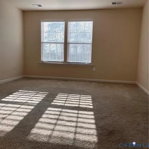 a bathroom with a granite countertop sink and a bathtub