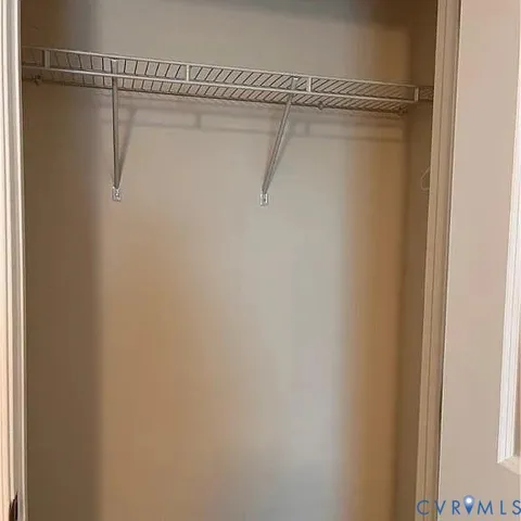 a kitchen with stainless steel appliances granite countertop a refrigerator a stove and a sink with wooden floor