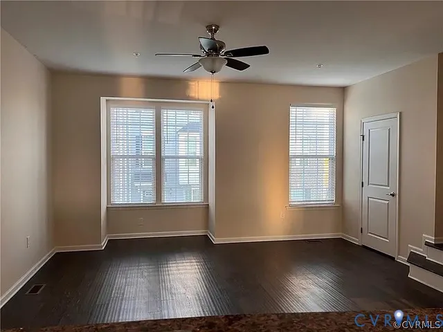 a kitchen with granite countertop a stove and a refrigerator