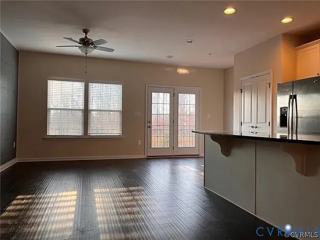a view of hallway with wooden floor