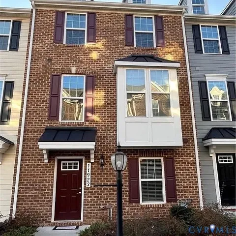 a front view of a house with yard