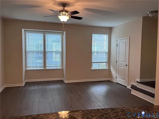 a view of livingroom with hardwood floor and ceiling fan