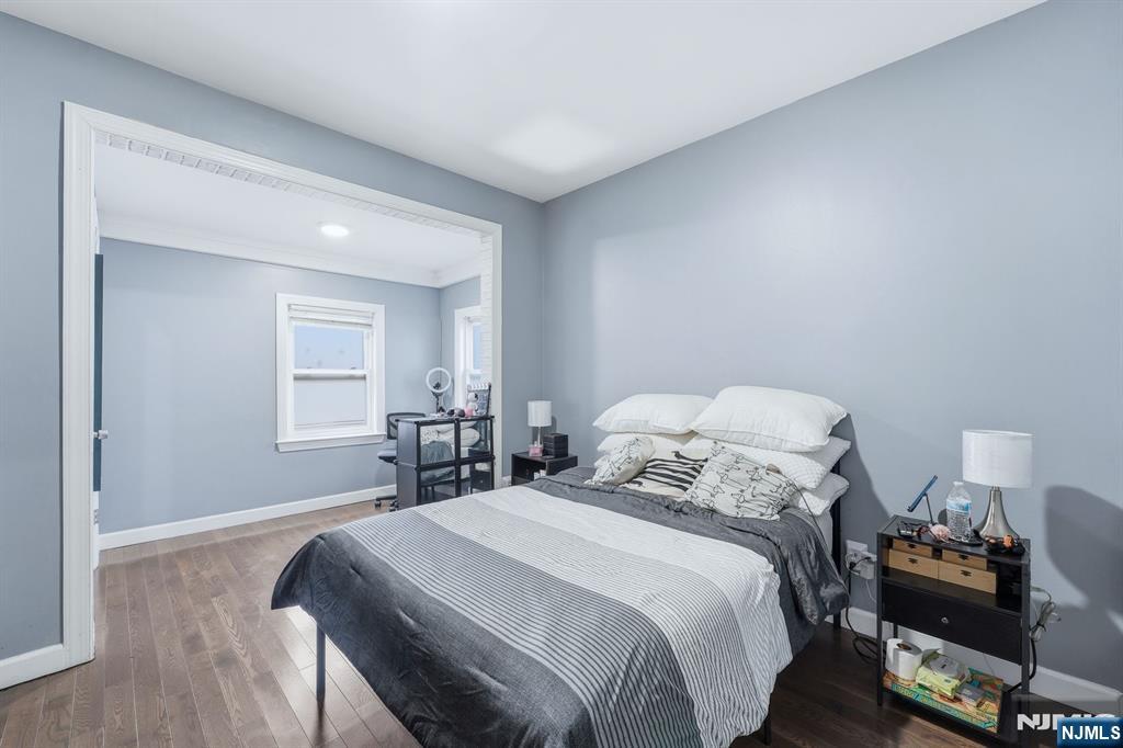757 Thomas Street Elizabeth, NJ 07202 - Photo 12 of 38 a bedroom with a bed and wooden floor