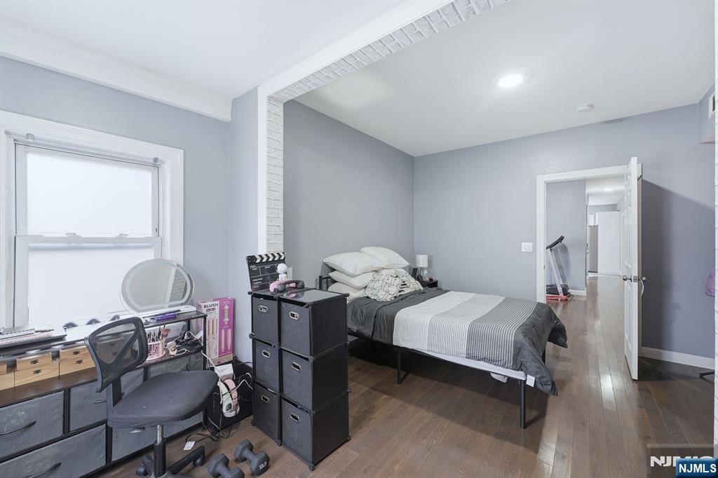 757 Thomas Street Elizabeth, NJ 07202 - Photo 13 of 38 a bedroom with a bed and wooden floor