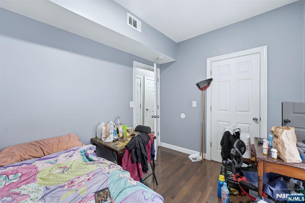757 Thomas Street Elizabeth, NJ 07202 - Photo 17 of 38 a bed room with a bed and a desk