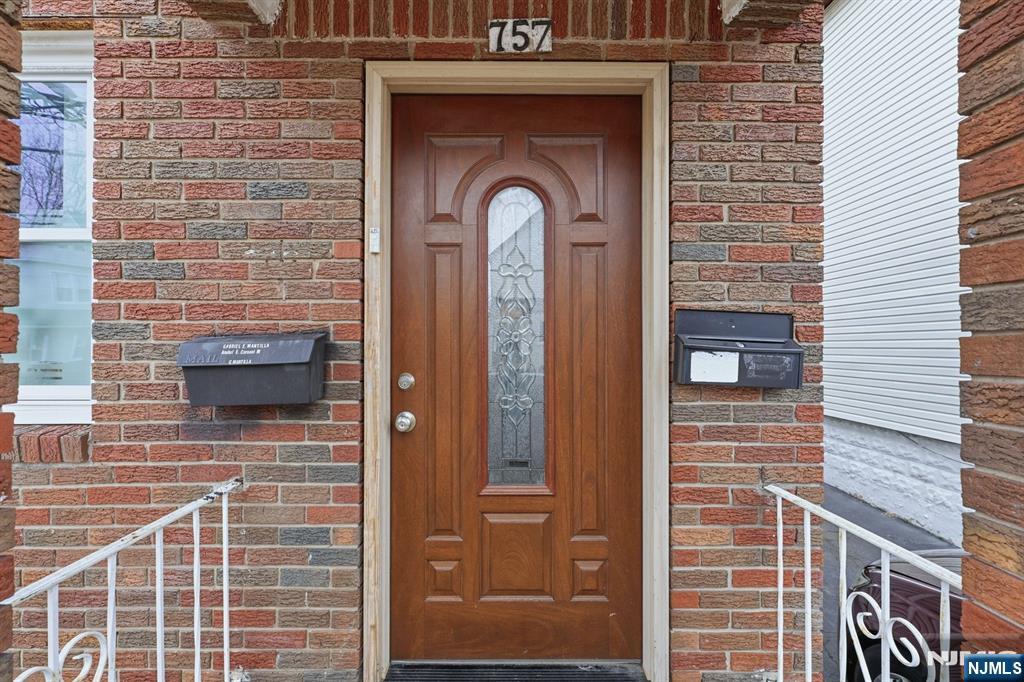 757 Thomas Street Elizabeth, NJ 07202 - Photo 2 of 38 a front view of a building with a door