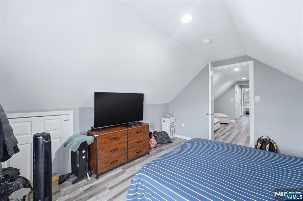 757 Thomas Street Elizabeth, NJ 07202 - Photo 26 of 38 a bedroom with furniture and flat screen tv