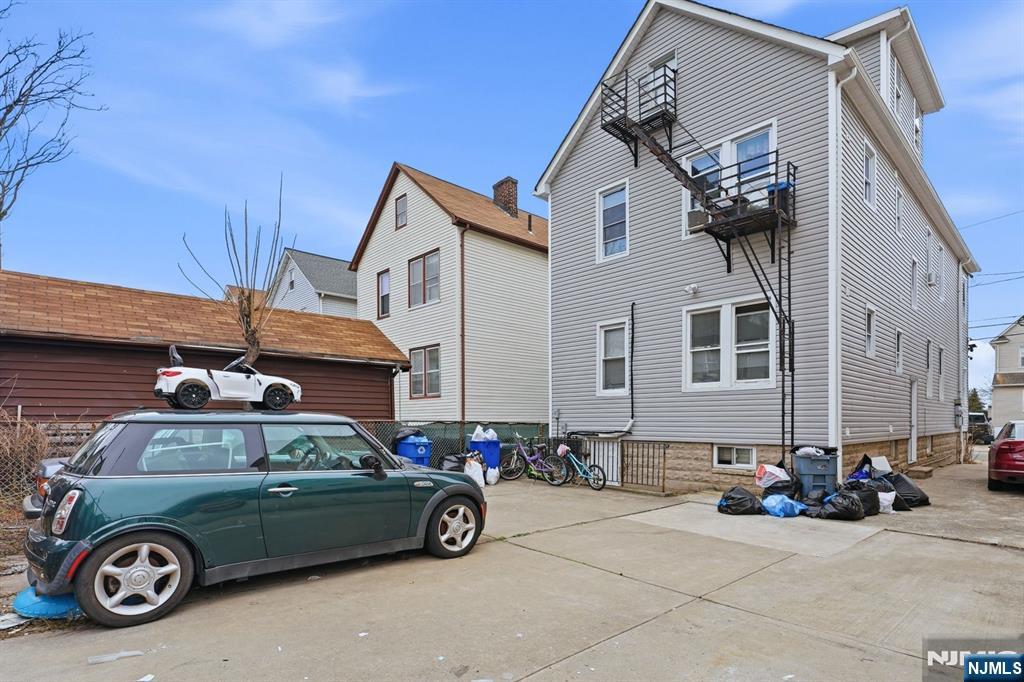 757 Thomas Street Elizabeth, NJ 07202 - Photo 38 of 38 a car parked in front of a house