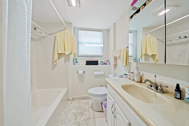 a bathroom with a sink a toilet and a bathtub