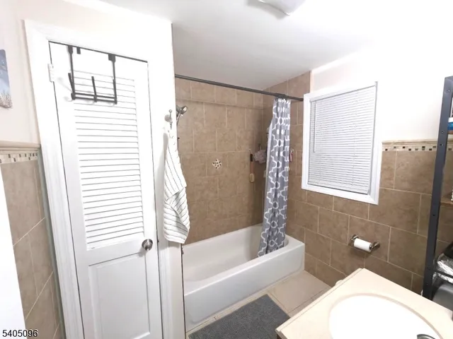 a bathroom with a toilet and a bathtub