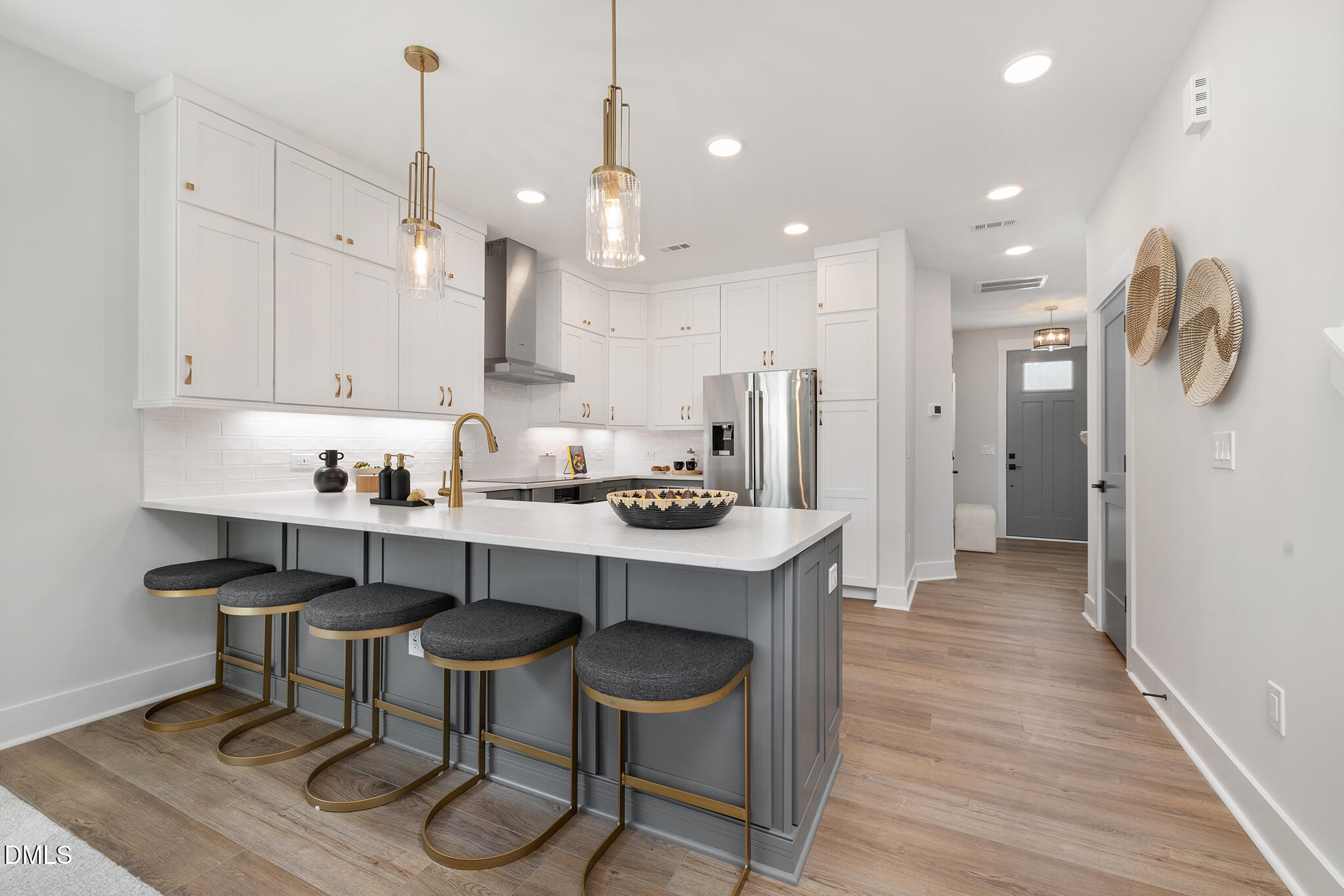 612 Cable Court Apex, NC 27523 - Photo 2 of 12 a kitchen with stainless steel appliances granite countertop a table chairs refrigerator and microwave