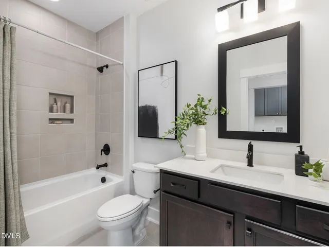 a picture of a bathroom with a window