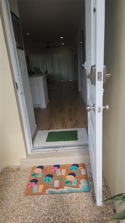 a bathroom with washing machine and tub