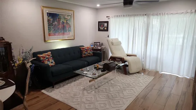 a living room with furniture and a bed