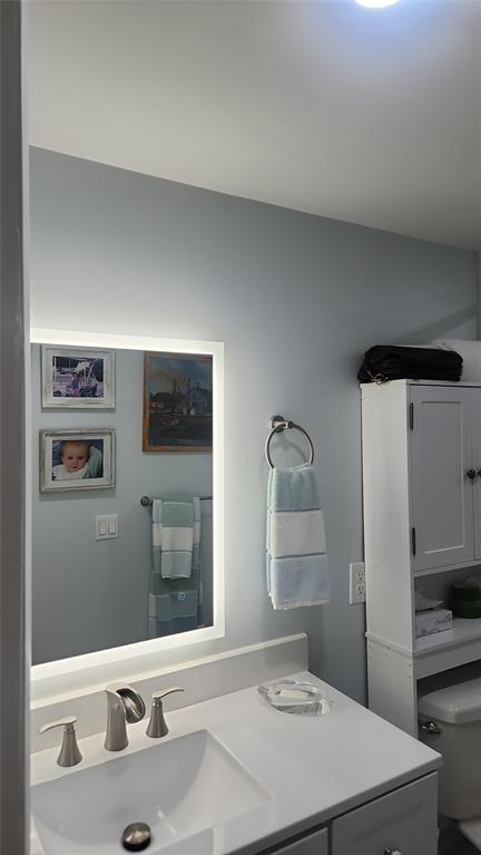 2202 Northeast 36th Street, Unit 15 Lighthouse Point, FL 33064 - Photo 17 of 47 a bathroom with a sink and a mirror