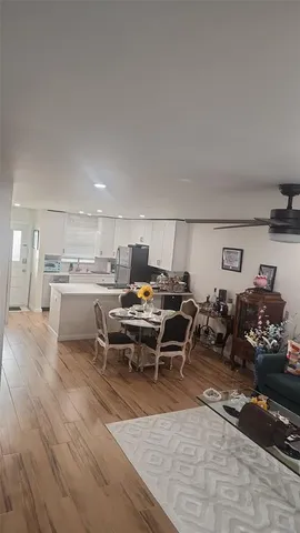 a living room with lots of furniture and clutter