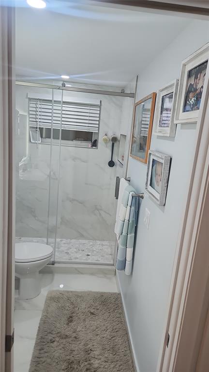 2202 Northeast 36th Street, Unit 15 Lighthouse Point, FL 33064 - Photo 18 of 47 a bathroom with a shower