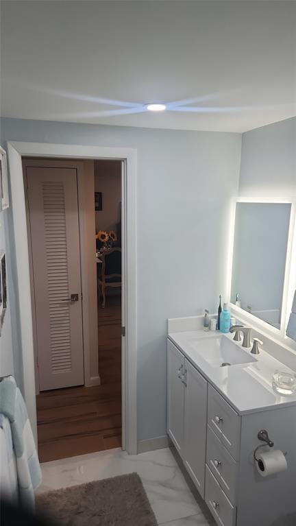 2202 Northeast 36th Street, Unit 15 Lighthouse Point, FL 33064 - Photo 19 of 47 a bathroom with a sink and a mirror
