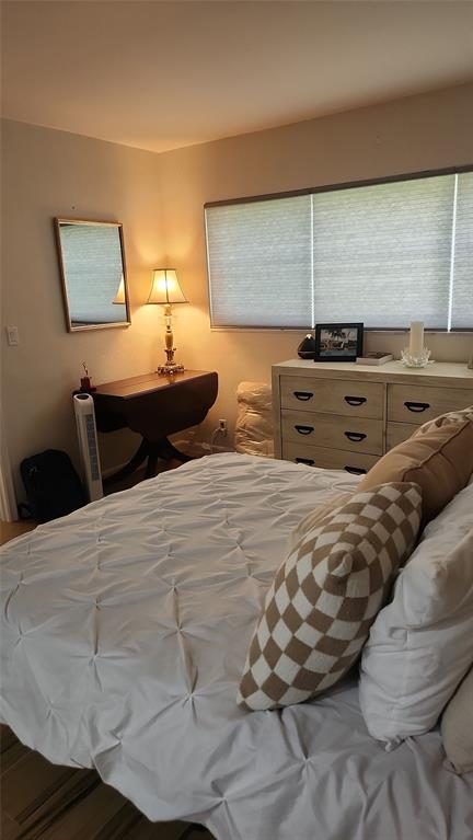 2202 Northeast 36th Street, Unit 15 Lighthouse Point, FL 33064 - Photo 22 of 47 a bedroom with a large bed and a window