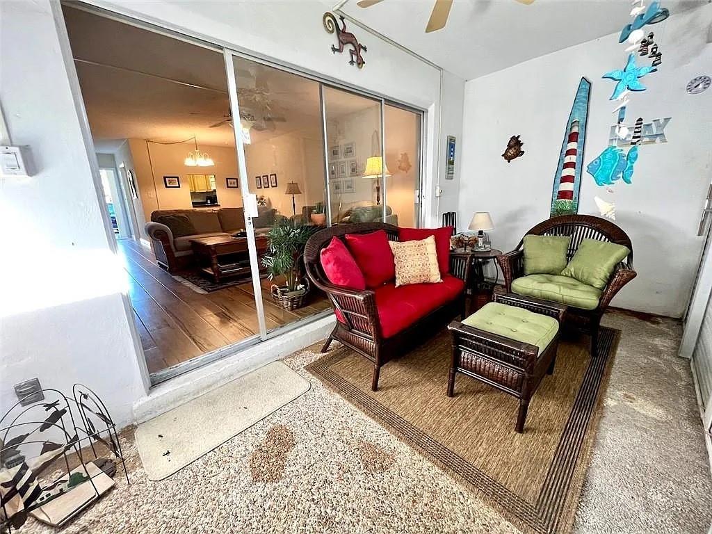 2202 Northeast 36th Street, Unit 15 Lighthouse Point, FL 33064 - Photo 39 of 47 a living room with furniture