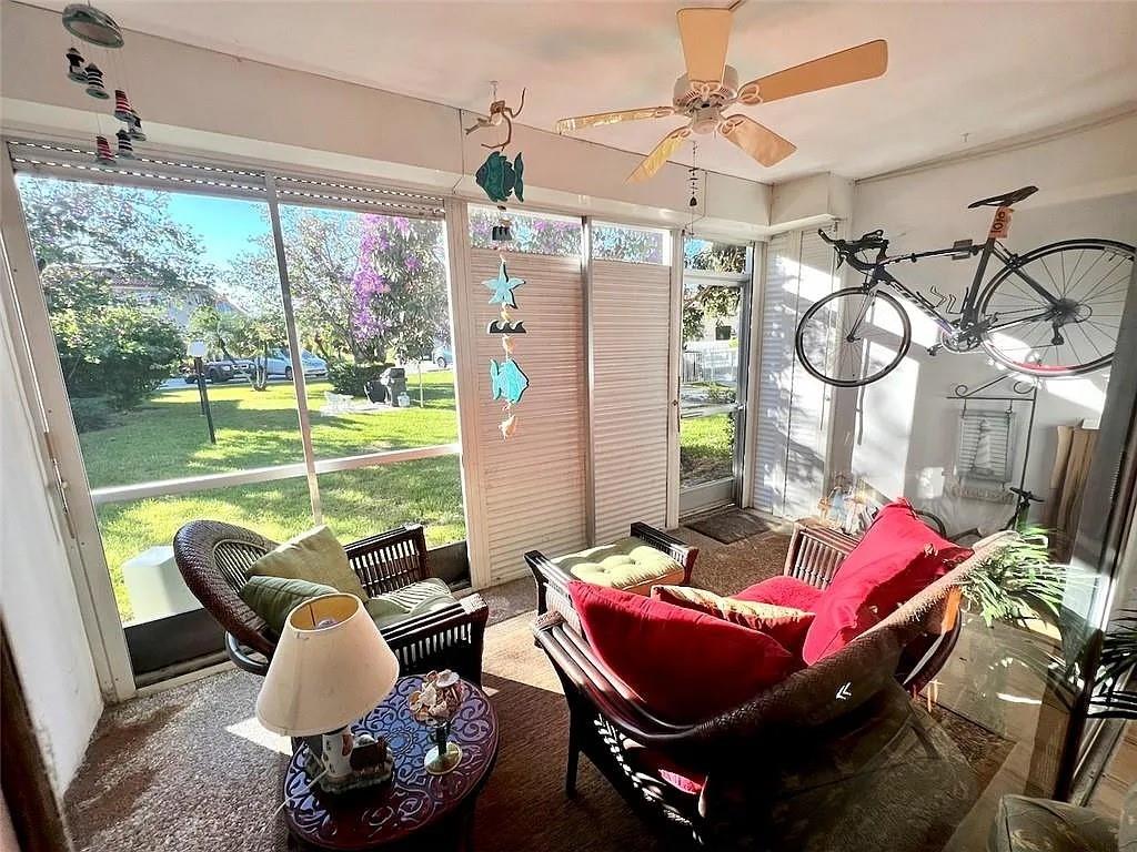 2202 Northeast 36th Street, Unit 15 Lighthouse Point, FL 33064 - Photo 40 of 47 a living room with furniture and a large window