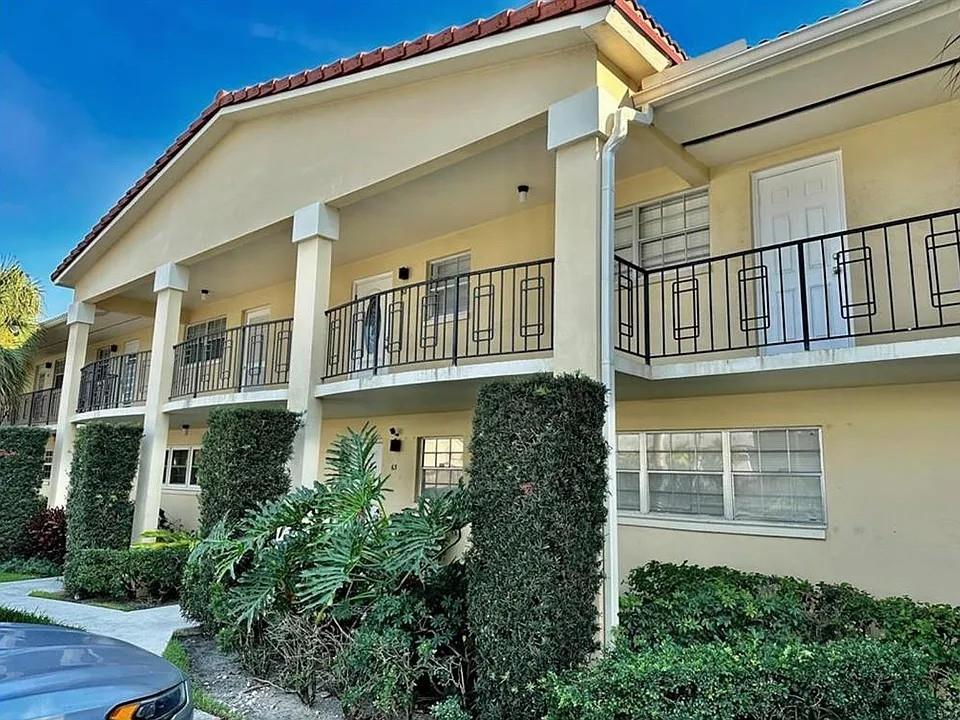 2202 Northeast 36th Street, Unit 15 Lighthouse Point, FL 33064 - Photo 47 of 47 a view of a building from a balcony