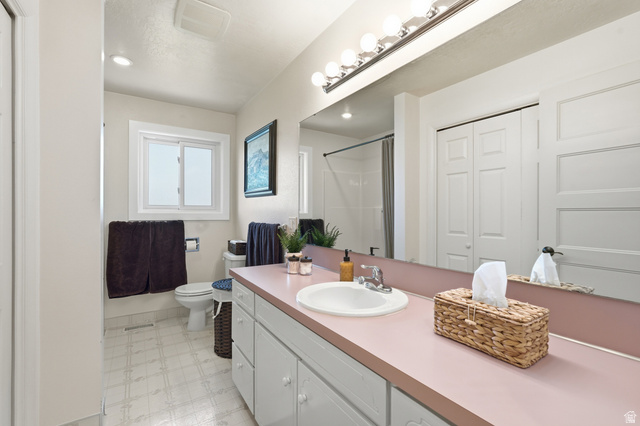 2420 West Old Hwy Road Morgan, UT 84050 - Photo 20 of 54 Bathroom featuring light flooring, a closet, vanity, a shower stall, and recessed lighting