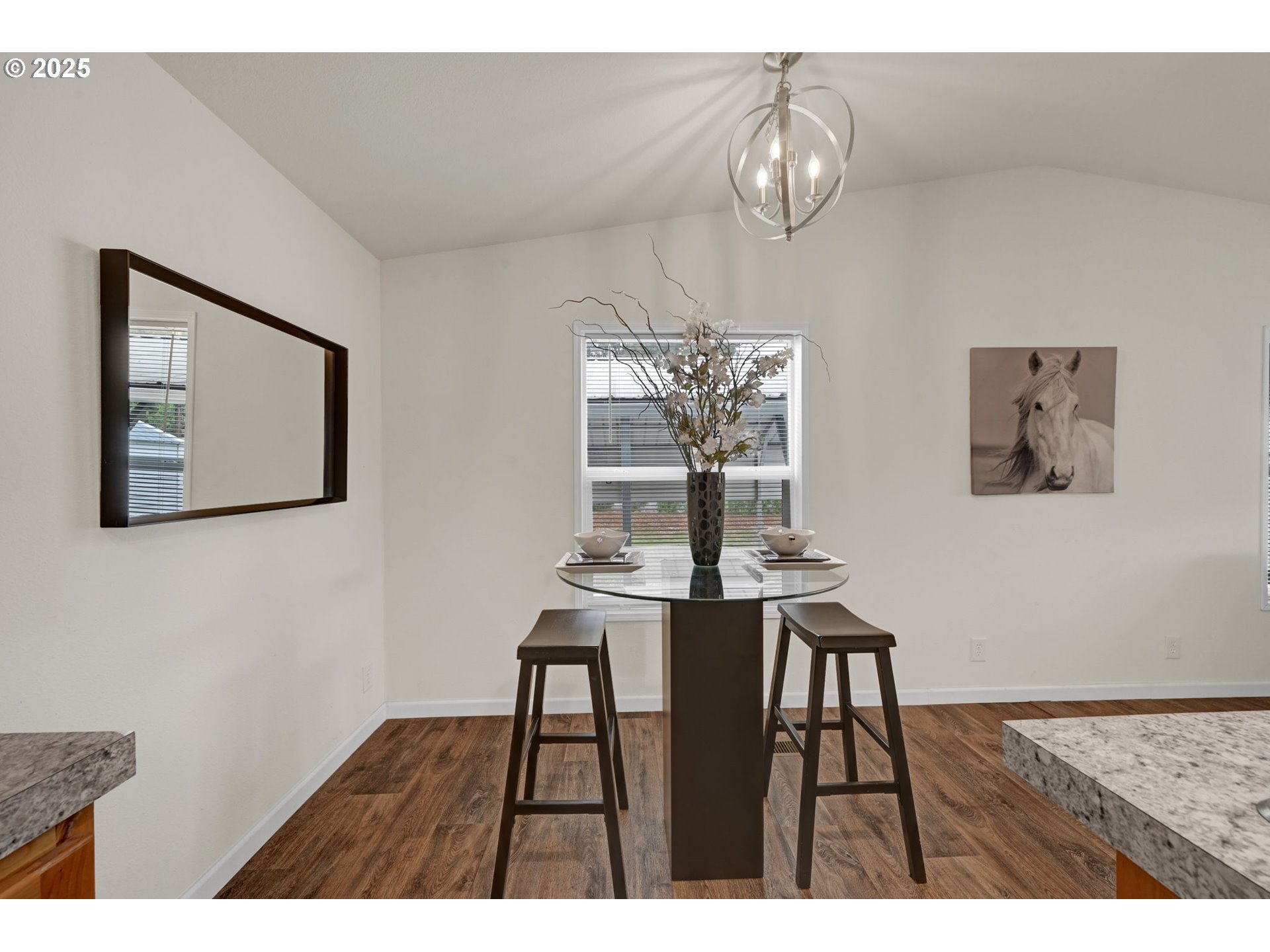 87886 Cedar Flat Road Springfield, OR 97478 - Photo 11 of 34 a view of a dining room with furniture a chandelier and wooden floor
