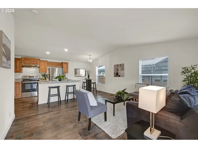 a living room with furniture and a table