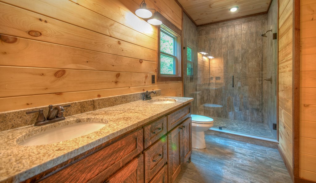 57 Devin Drive Murphy, NC 28906 - Photo 13 of 36 a bathroom with a granite countertop sink a toilet and shower