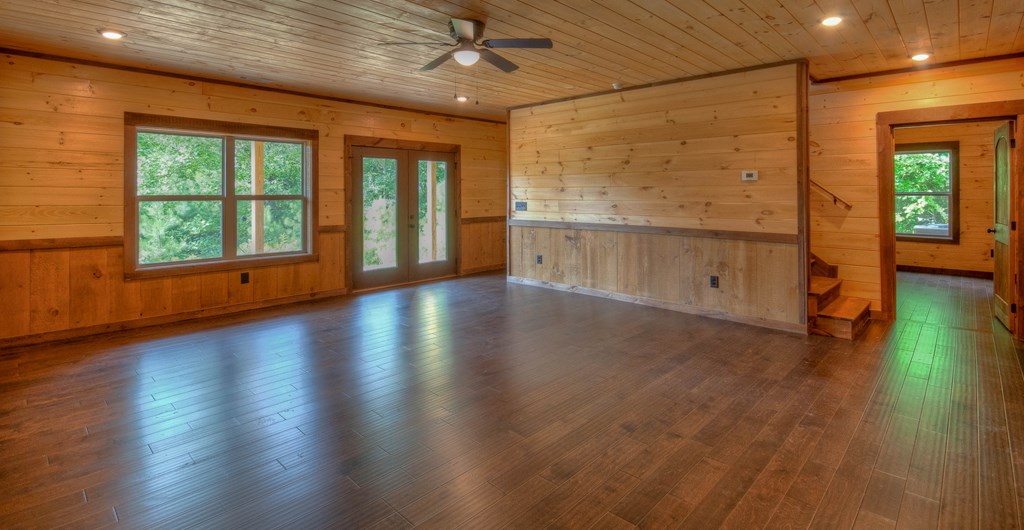 57 Devin Drive Murphy, NC 28906 - Photo 16 of 36 an empty room with wooden floor and windows