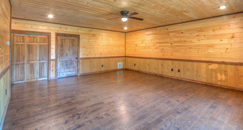 57 Devin Drive Murphy, NC 28906 - Photo 18 of 36 a view of an empty room with wooden floor and a window