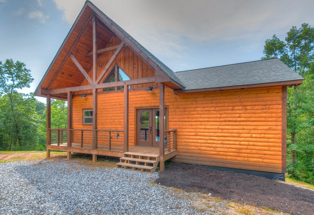57 Devin Drive Murphy, NC 28906 - Photo 3 of 36 a backyard of a house with barbeque oven table and chairs
