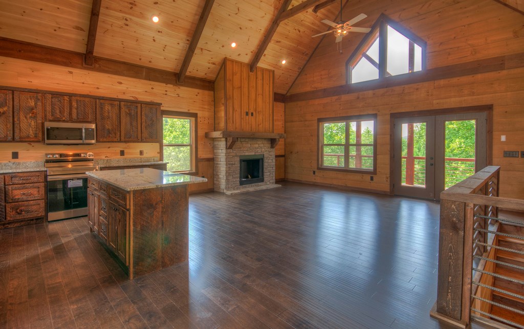 57 Devin Drive Murphy, NC 28906 - Photo 4 of 36 an open kitchen with kitchen island wooden floor and stainless steel appliances