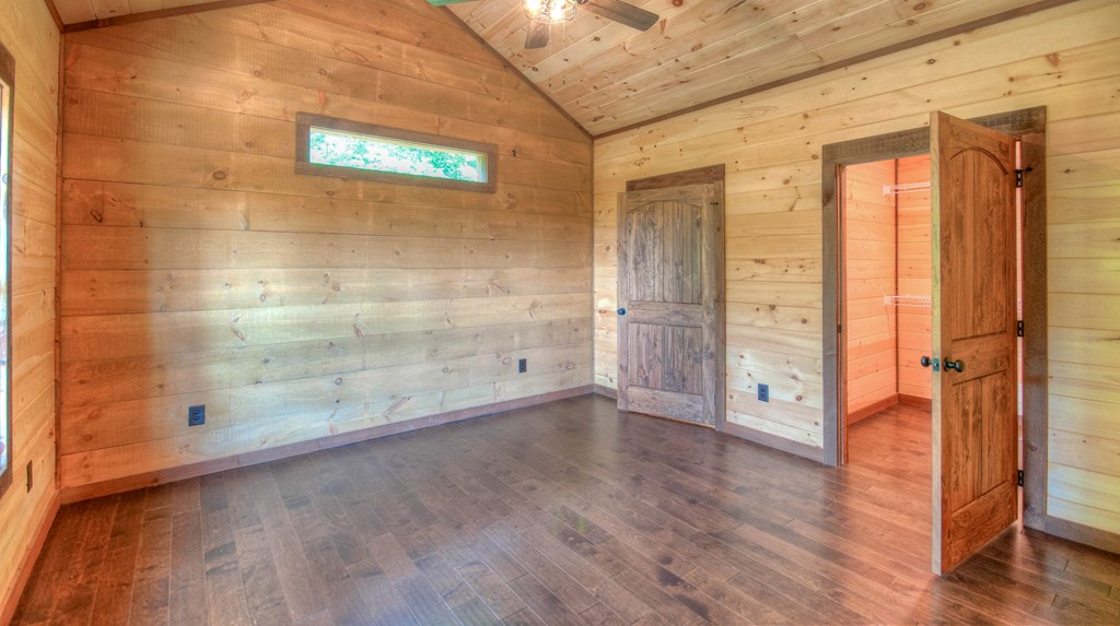 57 Devin Drive Murphy, NC 28906 - Photo 10 of 36 a view of a hallway with wooden floor and a bathroom